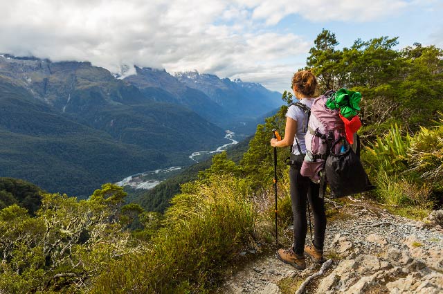 A female hiker enjoying the view on the Routeburn Track