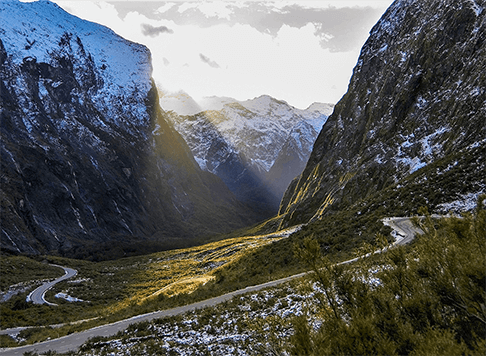 The Milford Road winding down through the Cleddau Valley with mountains on each side
